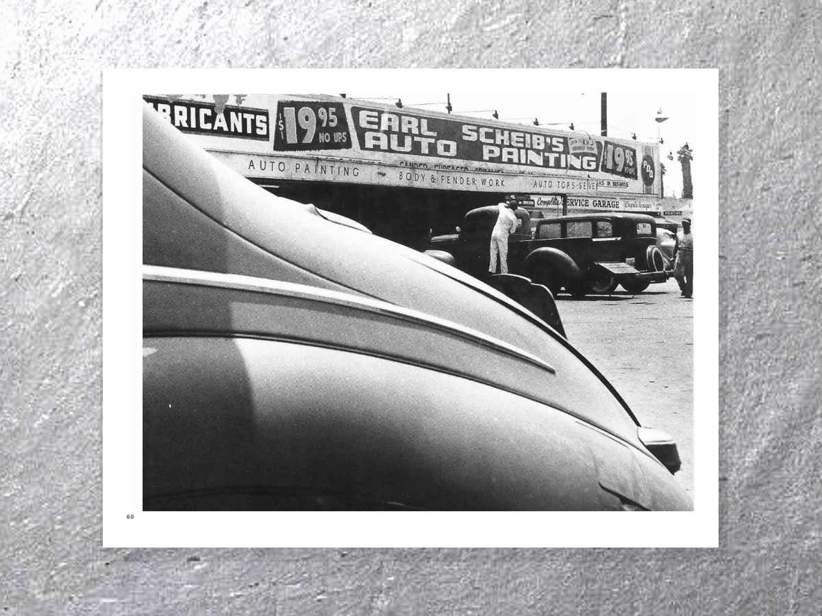 Earl Scheib auto painting shop with car trunk in foreground