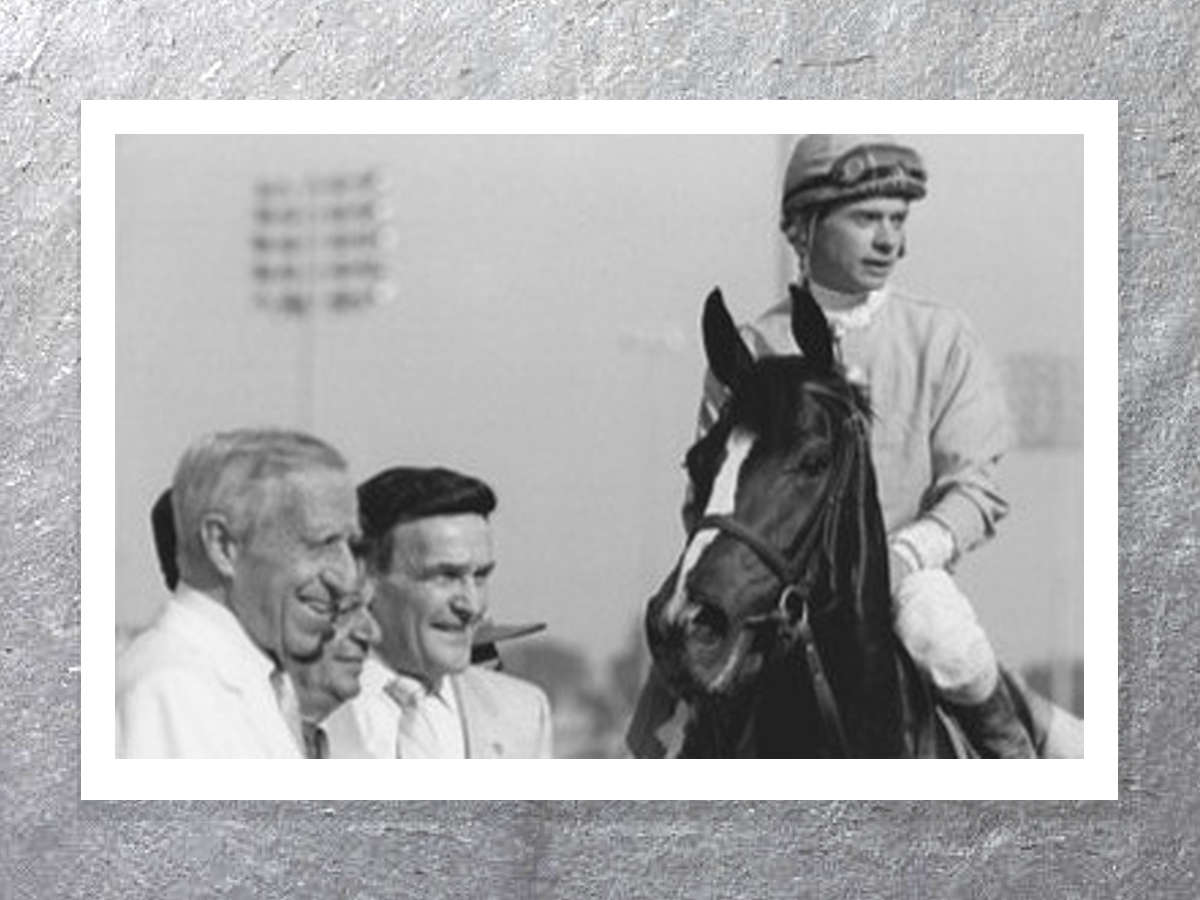 Winner’s circle photo — jockey on horse facing the camera